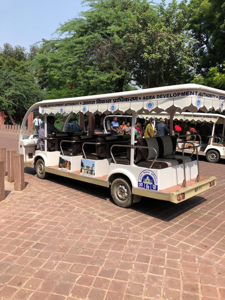 Electric vehicles take us between the heritage buildings in Agra