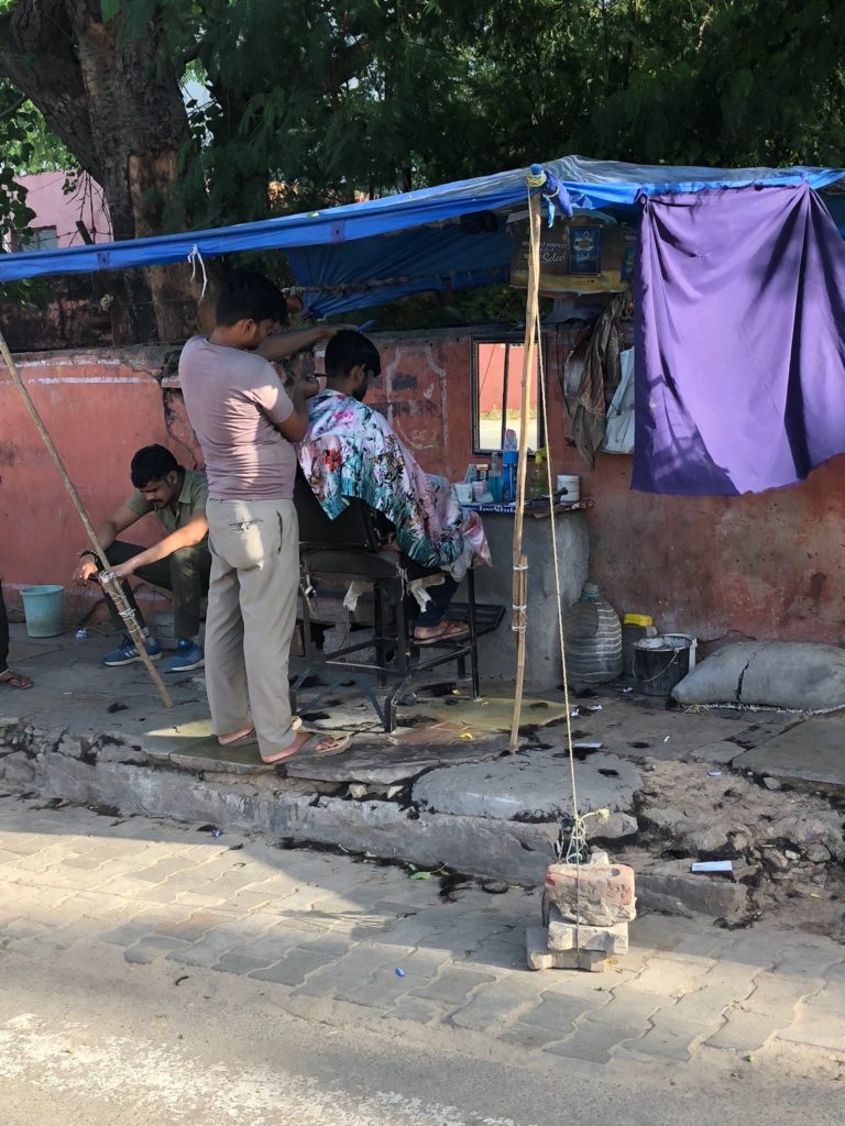 You can get your haircut on the street for a very reasonable price