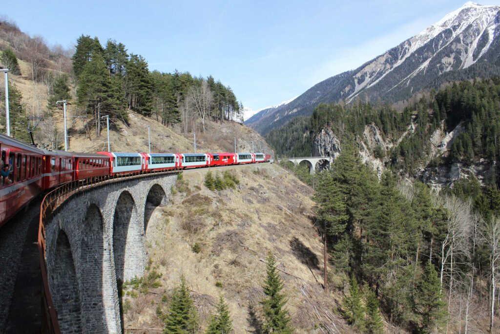 Enjoy taking the Glacier Express while touring Switzerland with Trafalgar, a Swisstainable-accredited company.